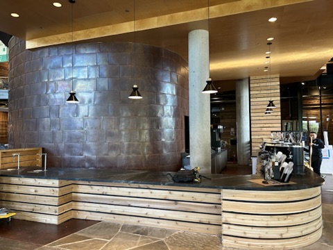 Tile wall and wood-clad counter taking shape